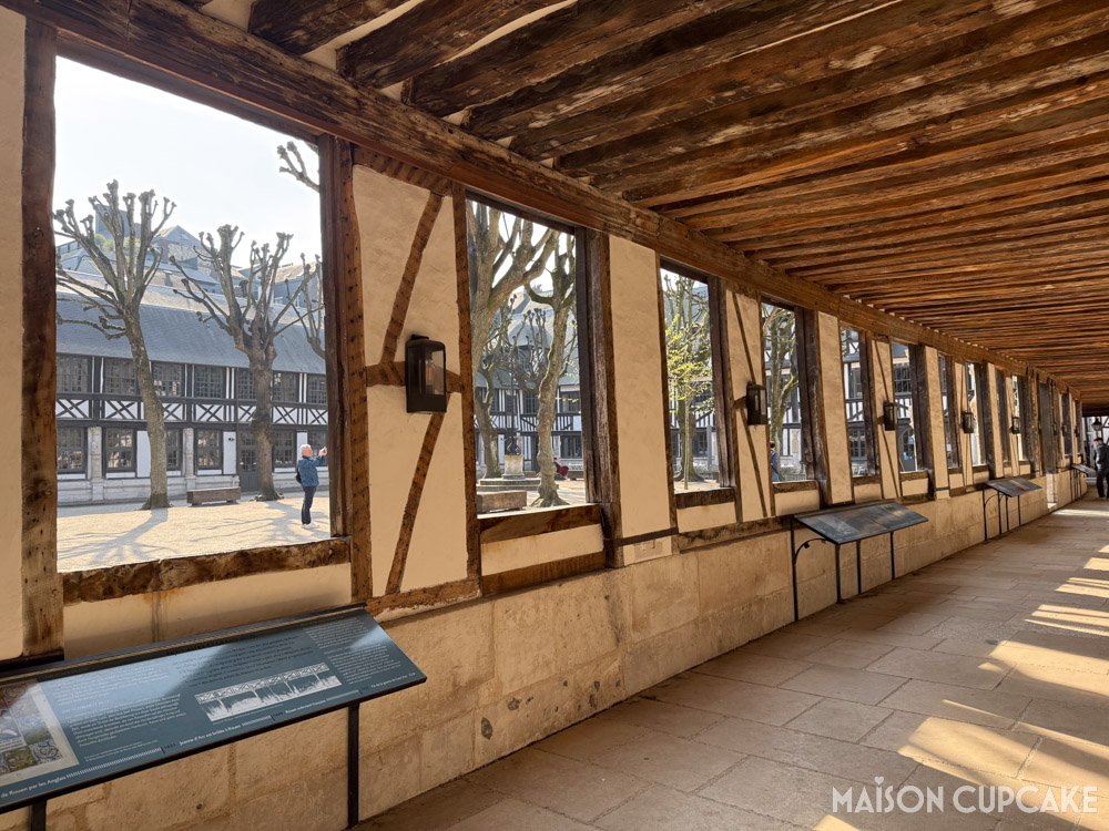 Timber ceilinged walkway overlooking Aître-Saint-Maclou in Rouen, Normandy, France.
