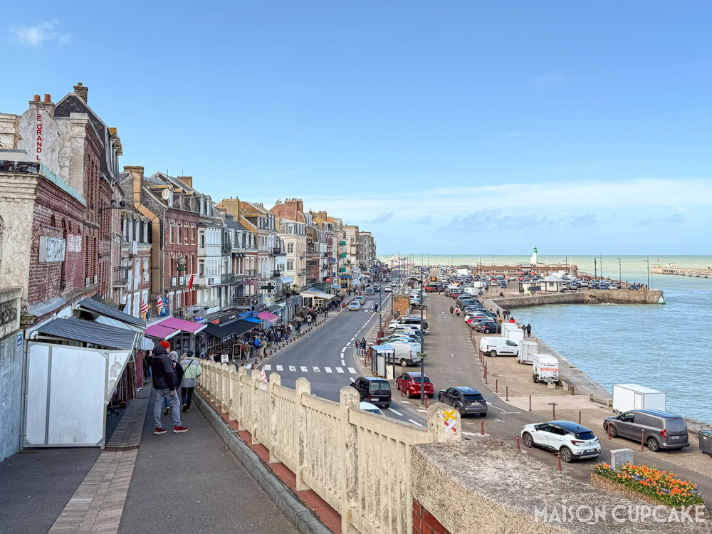 Le Tréport, northern France, with shops on harbour looking out to sea.