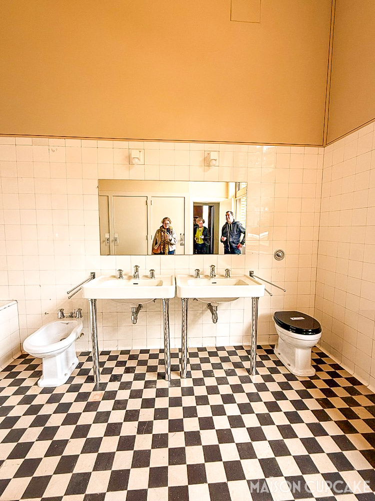 Restored bathroom space at Villa Cavrois showing chequered tiles and material contrast