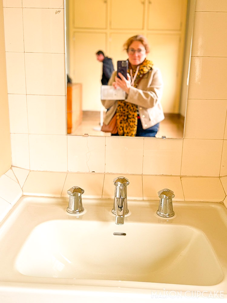 Close-up of Art Deco bathroom sink, taps and tiles detailing in Villa Cavrois modernist house
