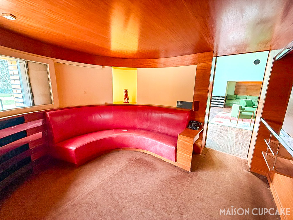 Round Art Deco smoking room with banquette seating, light feature and wooden ceiling at Villa Cavrois near Lille
